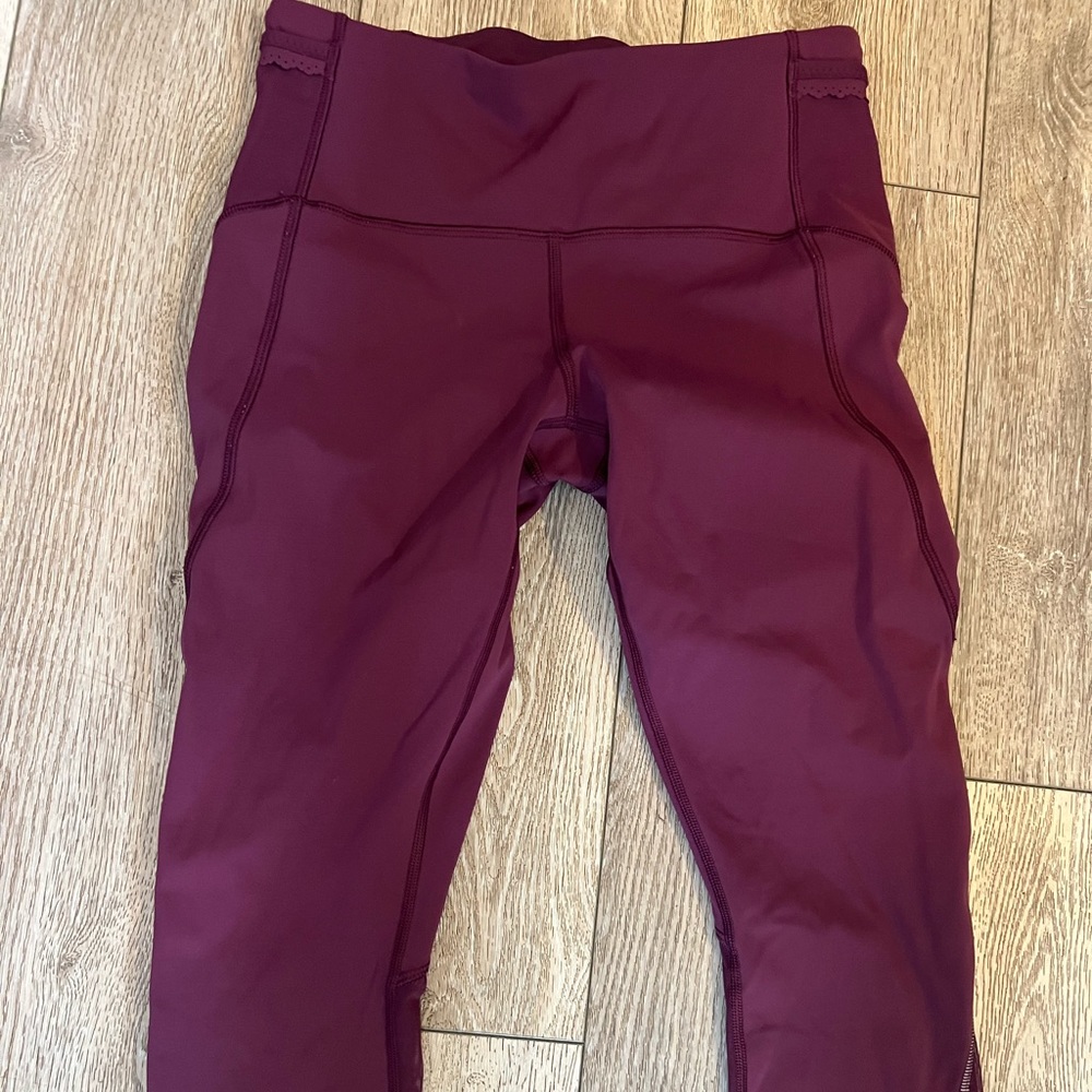 Wowmns Lululemon  leggings size 6 Small Stain See Pics. Color is a wine red.